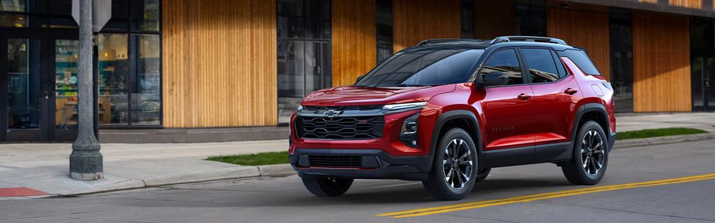 2025 Chevy Equinox offering a rugged and sophisticated look while driving on a city street