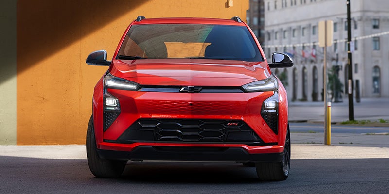 A front view of the 2027 Chevrolet Bolt, emphasizing its aerodynamic profile and contemporary styling against a neutral background.